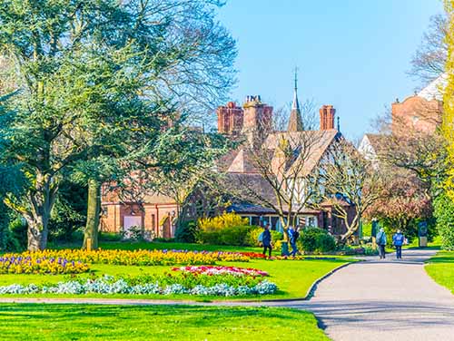 Green fields and a building in Grosvenor Park, Chester