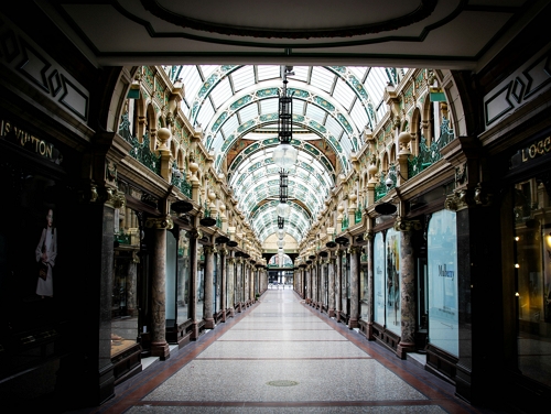 A quiet decorative hallway of shops in Leeds