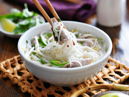 Bowl of noodles with chop sticks 